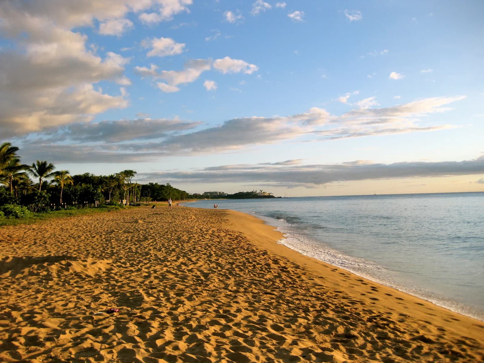 Warm evening light along the beach at Honua Kai